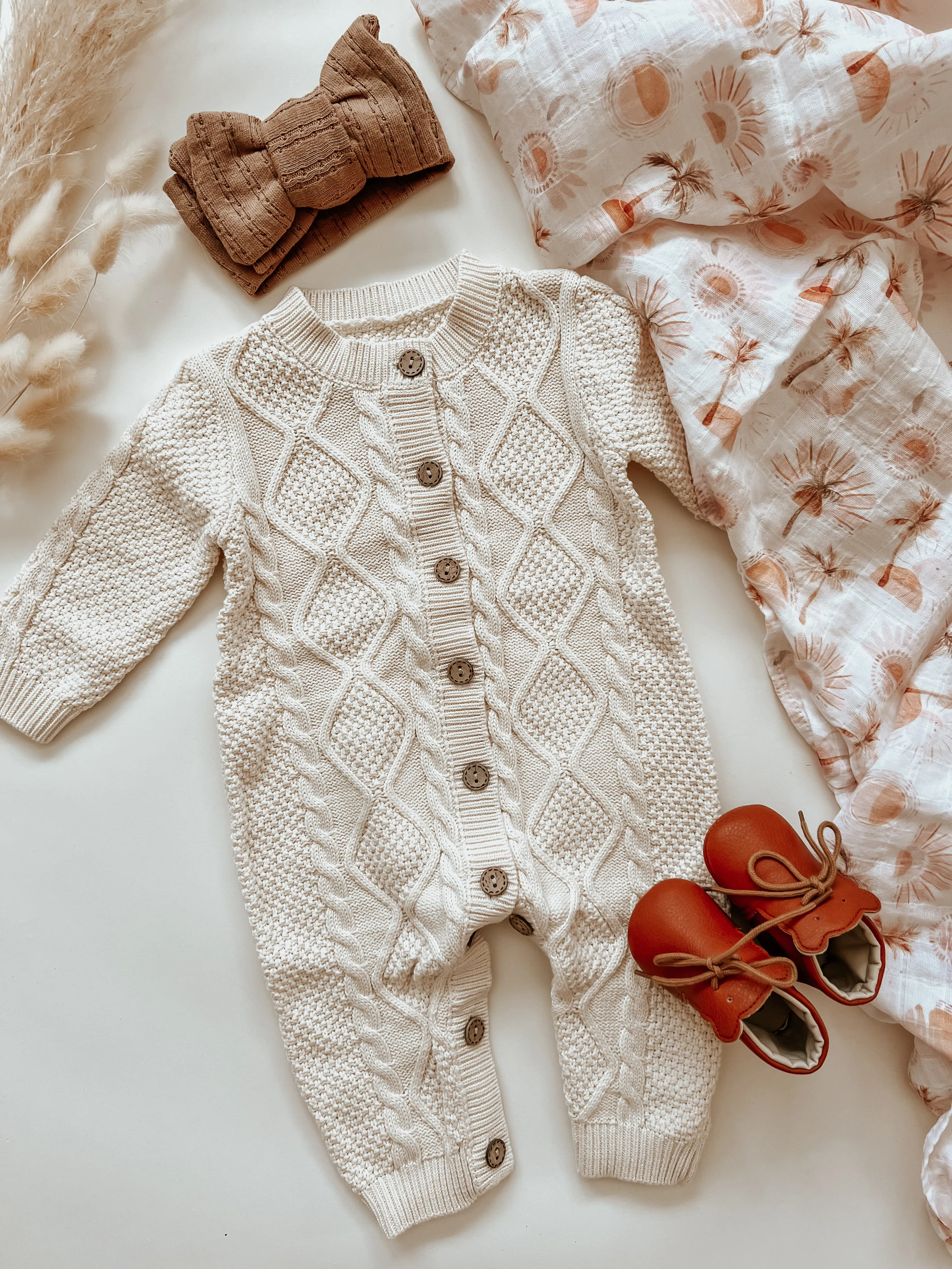 Knitted baby jumpsuit